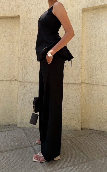 Woman wearing Sunday in St Tropez Black Co Ord Set Wide Leg side view