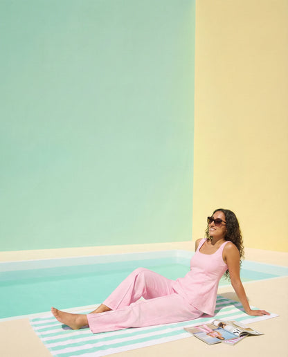 Woman wearing Sunday in St Tropez Pink Co Ord Set Wide Leg sitting relax